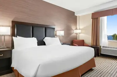 a large white bed in a hotel room at Best Western Plus Fergus Hotel in Fergus