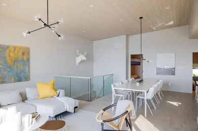 a living room with a couch and a table at Lakeview House by Leavetown Vacations in Lakefield