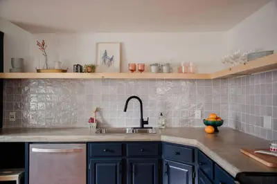 a kitchen with a sink and a counter top at The Dainty Petunia in Picton