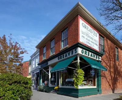 a brick building with a sign on the front of it at Greaves Sweet Escape in Niagara on the Lake