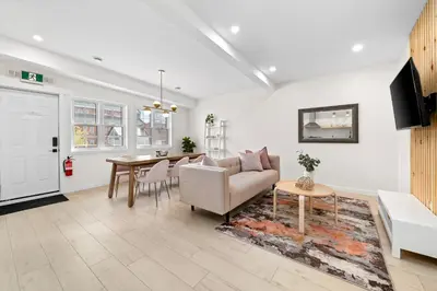 a living room with a couch and a table at The Belvedere:Front Street Flats in Belleville
