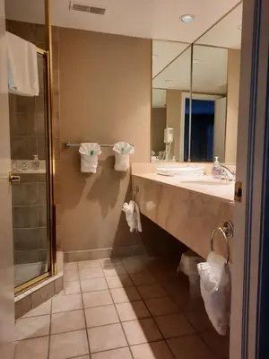 a bathroom with a sink and a shower and a mirror at Margarita Vacation Getaway in Oro-Medonte