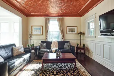 a living room with a couch and a table at Bramasole Bed and Breakfast in Roseneath