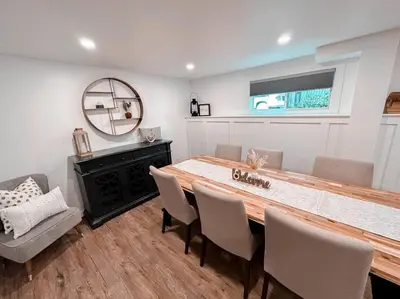 a dining room with a table and chairs and a mirror at The Victoria Suite in Elora- King Bed in Elora