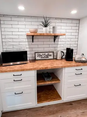 a kitchen with white cabinets and a counter top at The Victoria Suite in Elora- King Bed in Elora