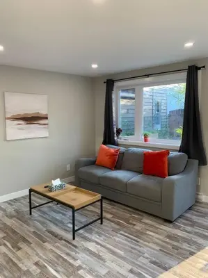 a living room with a couch and a table at ENTIRE 2 BEDROOM APARTMENT DOWNTOWN - u5 in Waterloo