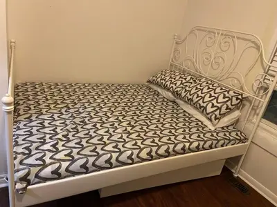 a white bed with a black and white mattress at BUDGET Triple Room with En Suite Bathroom 36A in Toronto