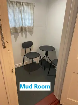 a room with two tables and two stools in it at BUDGET Quad Room with En Suite Bathroom 36B in Toronto
