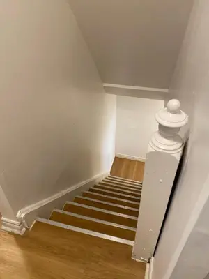 a staircase in a room with a white ceiling at Double Room with SHARED Bathroom 536B in Toronto