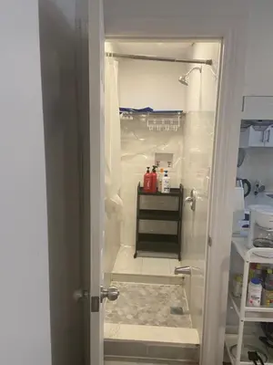 an open door to a kitchen with a refrigerator at Single Room with SHARED Bathroom 536C in Toronto