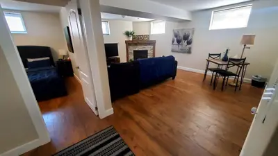 a living room with a couch and a table at Spacious Guest Suite in Hamilton