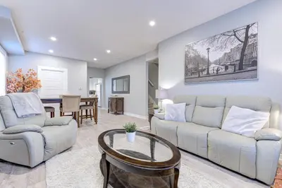a living room with a couch and a table at Niagara Falls-Toronto-45 Min Drive- 26 OOOO75-Max 8 in Hamilton