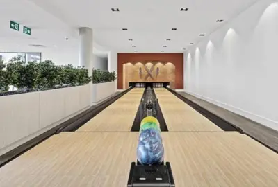 a bowling alley with a ball on the pins at 2 Bedroom, 2 Bath Stunning Condo - heart of Kitchener Downtown in Kitchener