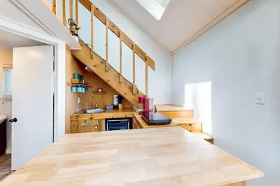 a kitchen with a wooden counter top in a room at The Lighthouse Cottage Four in Wasaga Beach