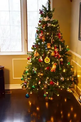 a christmas tree with ornaments on it in a room at Hidden Farm Escape in the Heart of Kawarthas in Beaverton