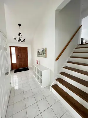 a staircase in a house with a stair case at Letitia Heights !G Stylish and Spacious Private Bedroom with Shared Bathroom in Barrie