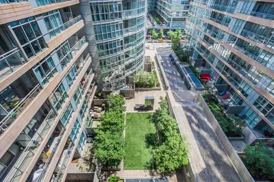 an aerial view of a street in a city with tall buildings at Cozy 2BR Close to CN Tower & Harbourfront in Toronto