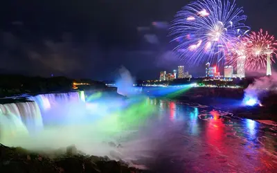 a firework display over the niagara falls at night at Two bedrooms unit with jacuzzi and great view in Niagara Falls