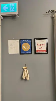 a wall with three signs and a pair of scissors at Adorable 2-bedroom unit with jacuzzi beside falls in Niagara Falls