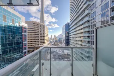 a balcony with a view of a city at 1 BR Furnished Condo with Balcony across CN Tower in Toronto