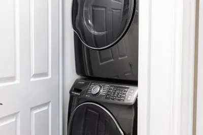 a microwave and a toaster oven sitting next to a door at Urban APT with Highspeed WiFi Near shopping malls in Toronto