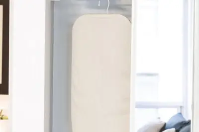 a white lamp hanging from a wall in a room at Urban APT with Highspeed WiFi Near shopping malls in Toronto