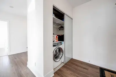a laundry room with a washer and dryer at Exec 2BR 2BTH w Million Dollar View of CN tower in Toronto
