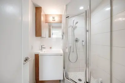 a bathroom with a shower and a sink at 2BR Fantastic View of CN Tower and Roger Centre in Toronto
