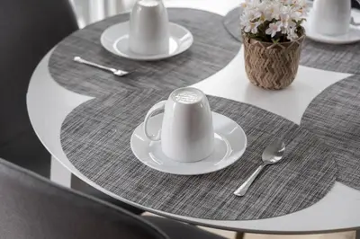 a table with plates and cups and spoons on it at Cozy Downtown 2BR Suite near CN Tower with Balcony in Toronto