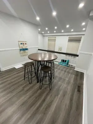 a dining room with a table and chairs in a room at Triple M Lodge Master Bedroom in Mississauga