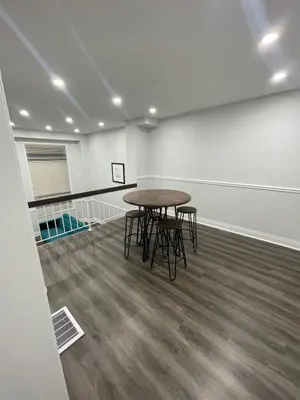 a room with a table and chairs in it at Triple M Lodge Master Bedroom in Mississauga