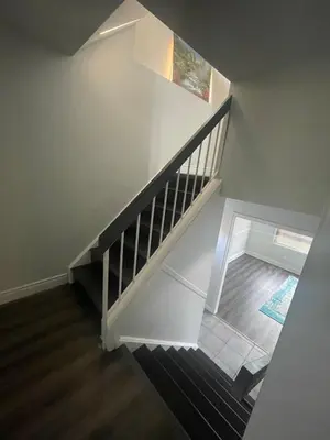 an overhead view of a staircase with a stair case at Triple M Lodge Master Bedroom in Mississauga