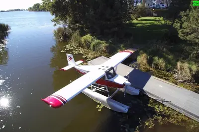 a small plane is sitting in the water at SkyTime Vacations in Wellington