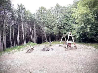 a playground with two swings and a swing at Cottage Retreat on 11 Acres in Flesherton