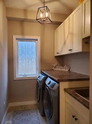 a kitchen with a washing machine and a window at 4 BD Family Retreat - Basement not Included in Stratford