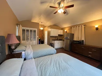 a bedroom with two beds and a ceiling fan at THE RED STAR room E in Niagara Falls