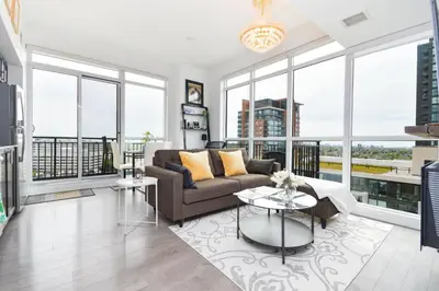 a living room with a couch and a table at The Splendid - Luxury 1BR Uptown Toronto in Toronto