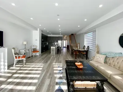 a living room with a couch and a table at 3 Bedroom Well-designed Townhouse in Whitby in Whitby