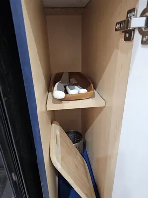 a room with two wooden shelves in a room at Poolside entire lower level apt in Whitby