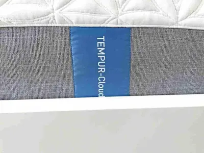 a mattress with a blue sign on the side of it at Hamilton Oasis - Luxe Beds - BBQ Haven - Pool in Hamilton