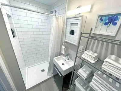 a bathroom with a sink and a shower at Hamilton Oasis - Luxe Beds - BBQ Haven - Pool in Hamilton