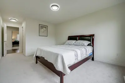 a bedroom with a large bed in a room at 922 Logan Drive in Milton