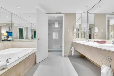 a large bathroom with two sinks and two mirrors at Cozy Getaway with Resort Perks in Edgar