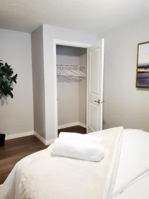 a white bedroom with a white bed and a door at *NEW: Stylish Wortley 1BR Suite in London