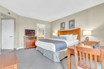 a bedroom with a bed and a desk and a television at Quite in Nature in Edgar