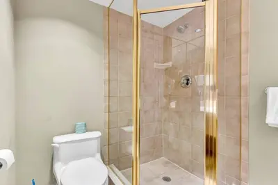 a bathroom with a shower stall and a toilet at Quite in Nature in Edgar