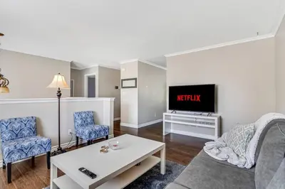 a living room with a couch and a tv at Fun & Cozy Retreat: Nature & Games in Trenton