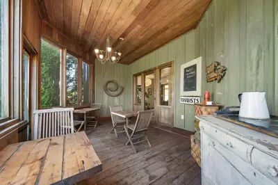 a room with a table and chairs and a dining room at Away in the County-Sandbanks Pec in Cherry Valley