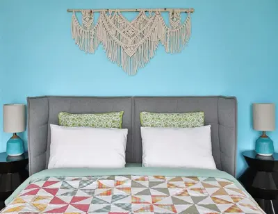 a bedroom with a bed with a heart on the wall at Lakeside PEC: Beautiful Waterfront & Patio in Wellington