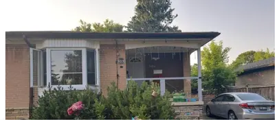 a house with a car parked in front of it at Affordable stay near the OPG TV and parking in Pickering